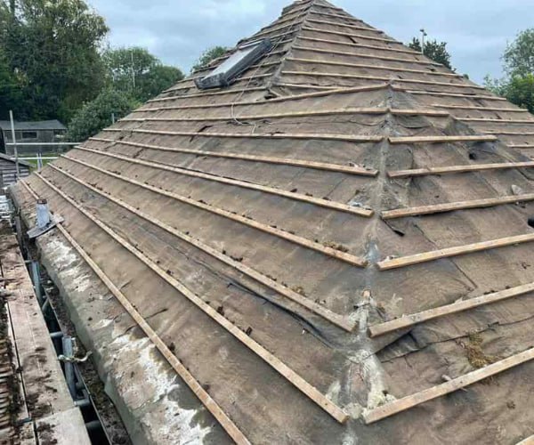 This is a photo of a hip roof that has been stripped back to the battens, and is awaiting a new roof covering to be installed. Works carried out by EDS Roofing Stainforth