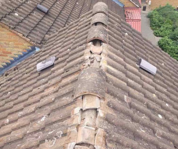 This is a photo if a roof ridge which has missing tiles. The ridge tiles are being replaced by EDS Roofing Stainforth