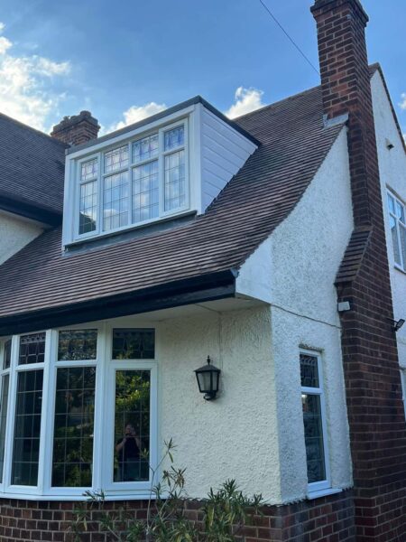 This is a photo of a dormer window which has just had some repairs carried out where the roof and the dormer meet.